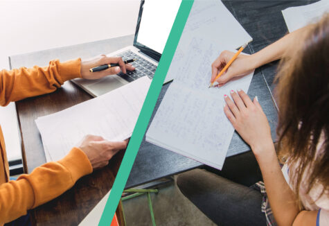 Two students studying, one using a laptop and taking notes, the other writing in a notebook