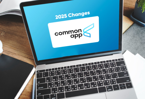 A laptop on a wooden desk displays the Common App logo and headline about 2025 application changes